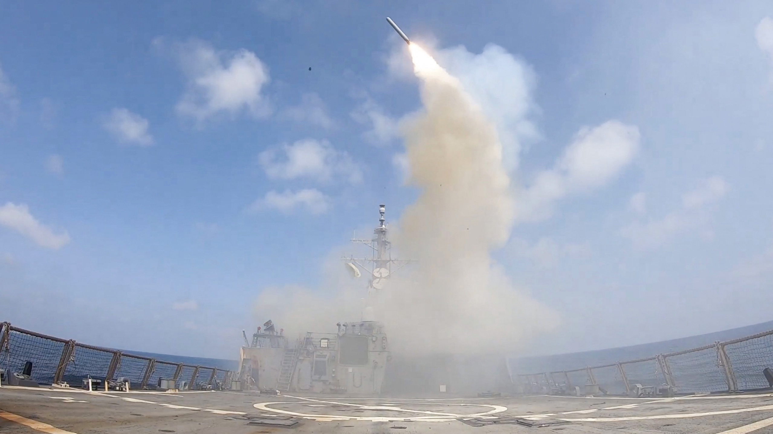 In this screen grab obtained on February 28, 2026 from video released by the US Central Command on their X account @CENTCOM shows the Arleigh Burke class guided-missile-destroyer, USS Spruance (DDG 111), firing Tomahawk Land Attack Missiles in support of Operation Epic Fury, from an undisclosed location on February 28, 2026. The United States and Israel launched a wave of strikes against targets in Iran on February 28, sparking swift retaliation by the Islamic republic which responded with missile attacks across the region. (Photo by US Central Command (CENTCOM) / AFP) / RESTRICTED TO EDITORIAL USE - MANDATORY CREDIT 